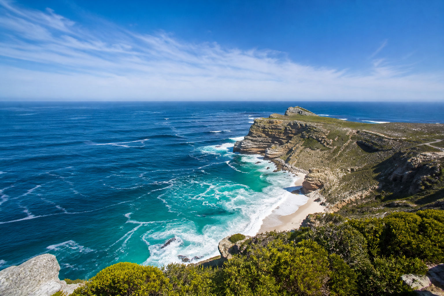 Dramatic Cape Point cliffs meeting turquoise Atlantic and Indian Ocean waters